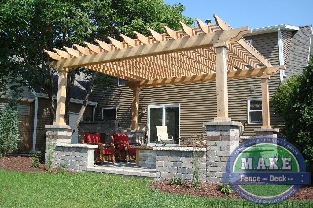 Cedar pergola with stone columns post bases