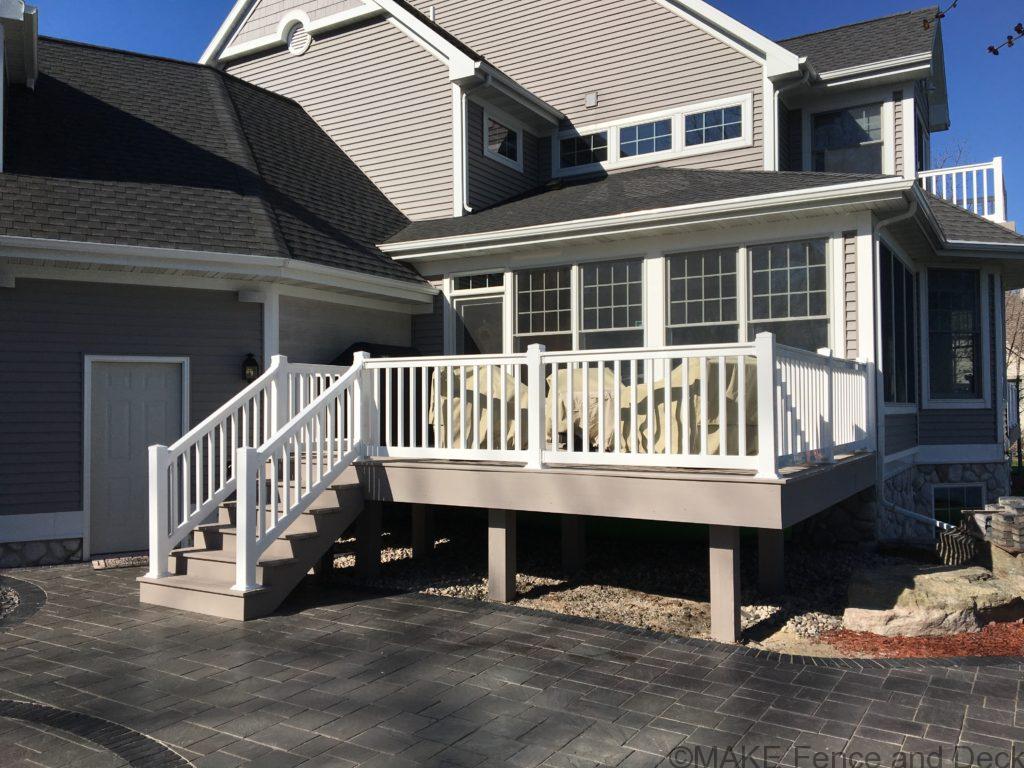 Azel Slate Gray decking with white vinyl railing.