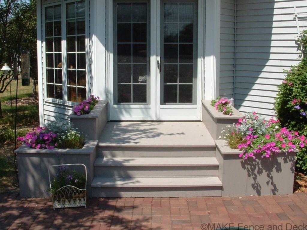 Gray Azek decking with built in planters.