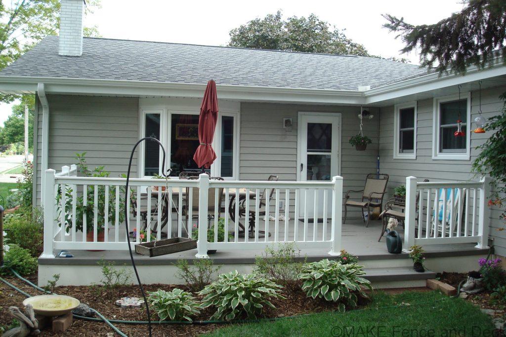 Gray Azek decking with white vinyl railing