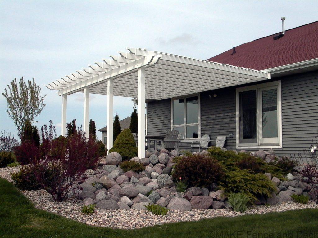 white vinyl pergola attached to house