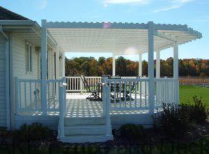 white vinyl pergola mounted on vinyl deck